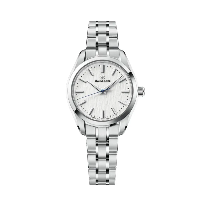 Snowflake Heritage Quartz 33mm watch with a white textured dial on a stainless bracelet