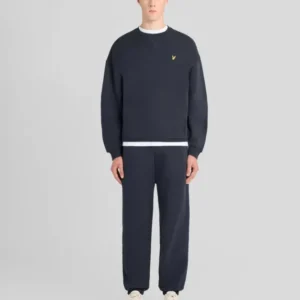 Man wears Heavyweight Loopback Cotton Joggers in Dark Navy